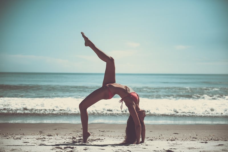 Woman using a yoga strap for stretching